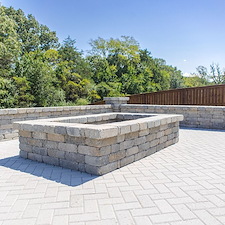 Sculpted-Comfort-Large-Paver-Patio-with-Fire-Pit-and-Custom-Seating-Walls 0